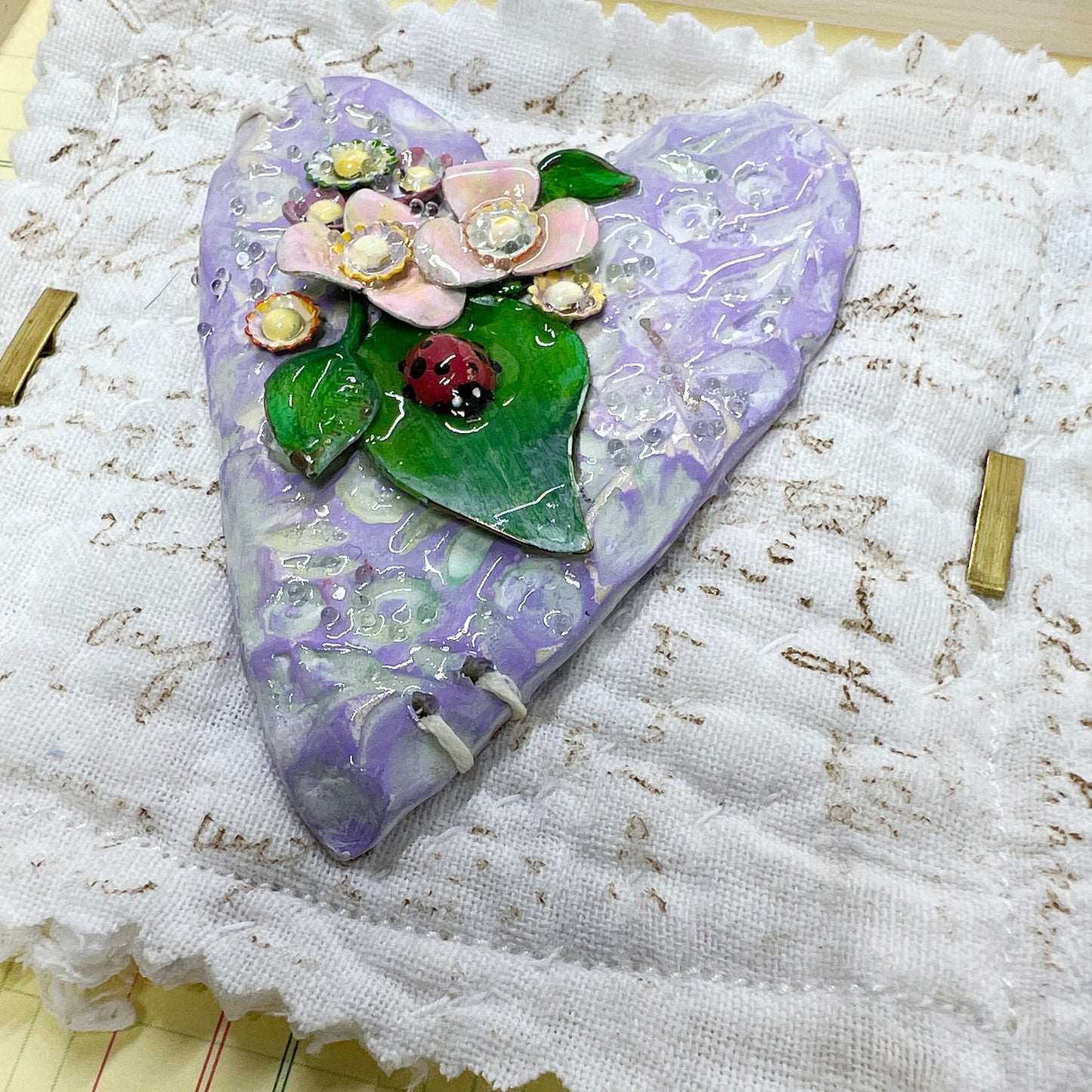 Handmade Heartfelt Sampler 8: framed hand sculpted heart with hand-painted enameled flowers by artist Tammy Tutterow