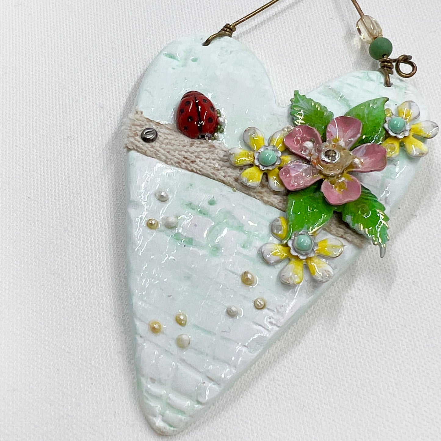 Handmade Heartfelt Ornament 11: hand sculpted heart with mixed media hand-painted enameled flowers by artist Tammy Tutterow