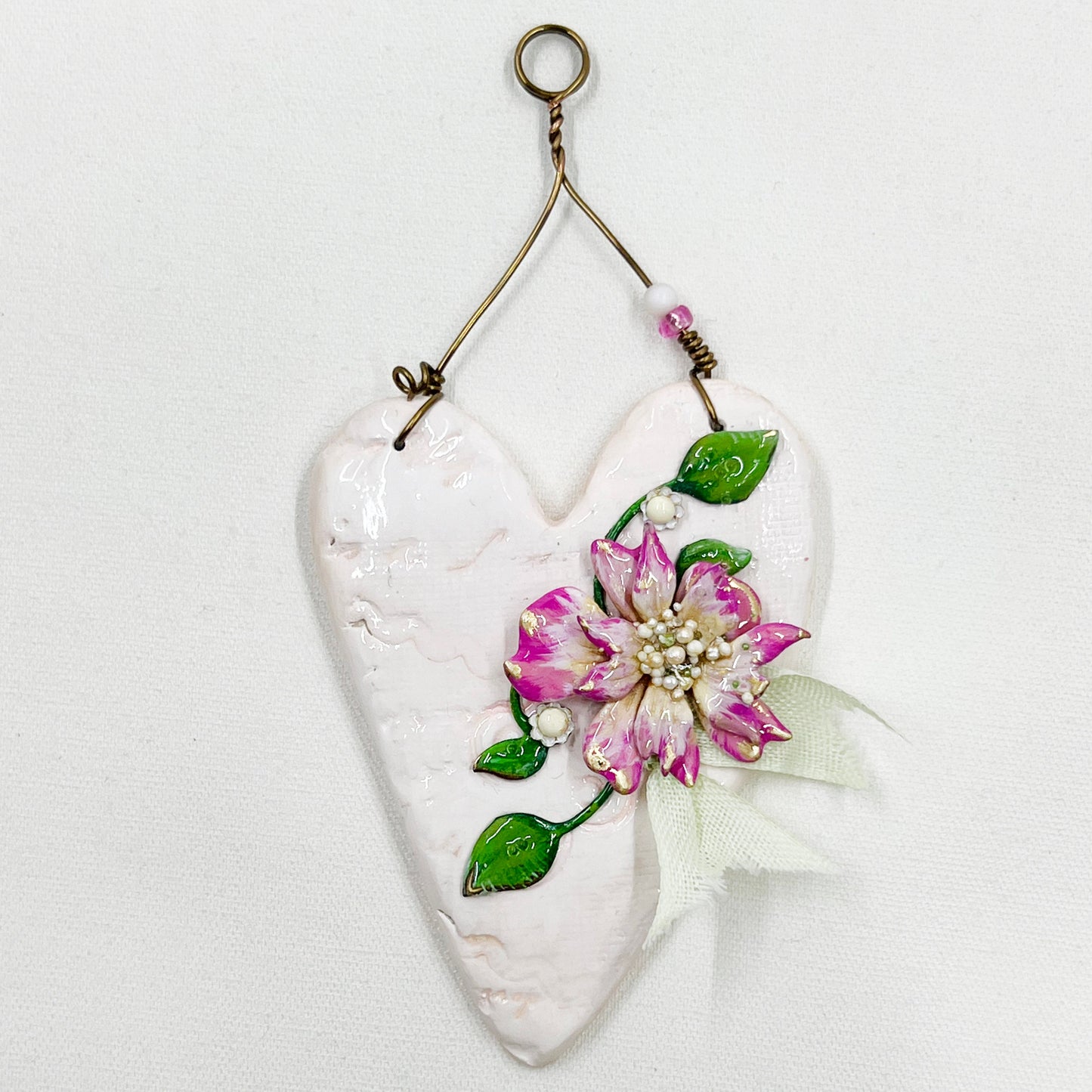 Handmade Heartfelt Ornament 12: hand sculpted heart with mixed media hand-painted enameled flowers by artist Tammy Tutterow