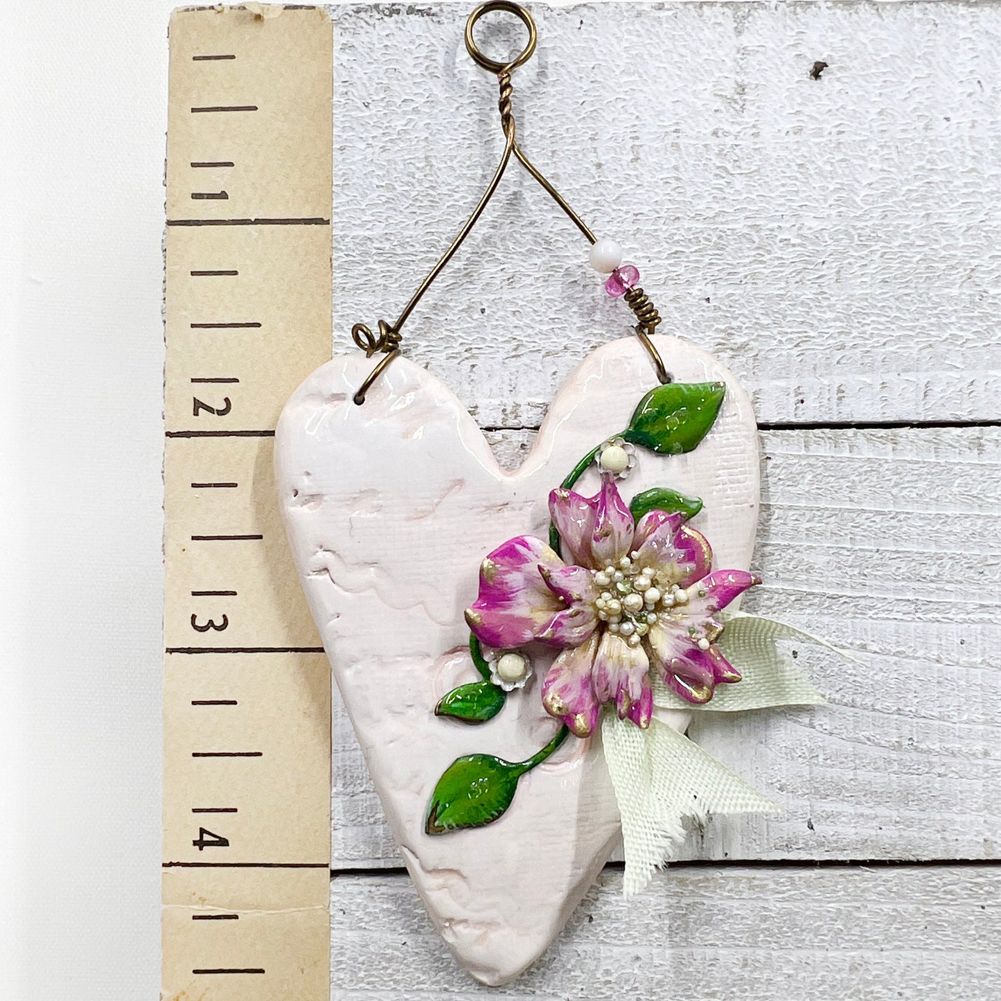 Handmade Heartfelt Ornament 12: hand sculpted heart with mixed media hand-painted enameled flowers by artist Tammy Tutterow