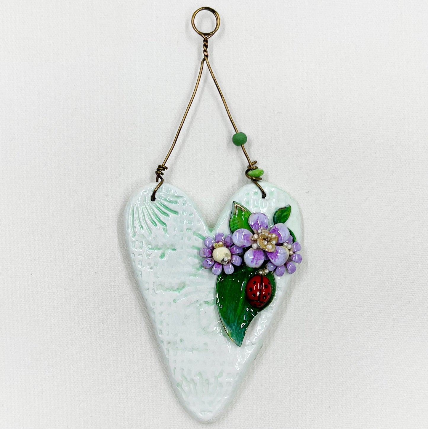 Handmade Heartfelt Ornament 13: hand sculpted heart with mixed media hand-painted enameled flowers by artist Tammy Tutterow