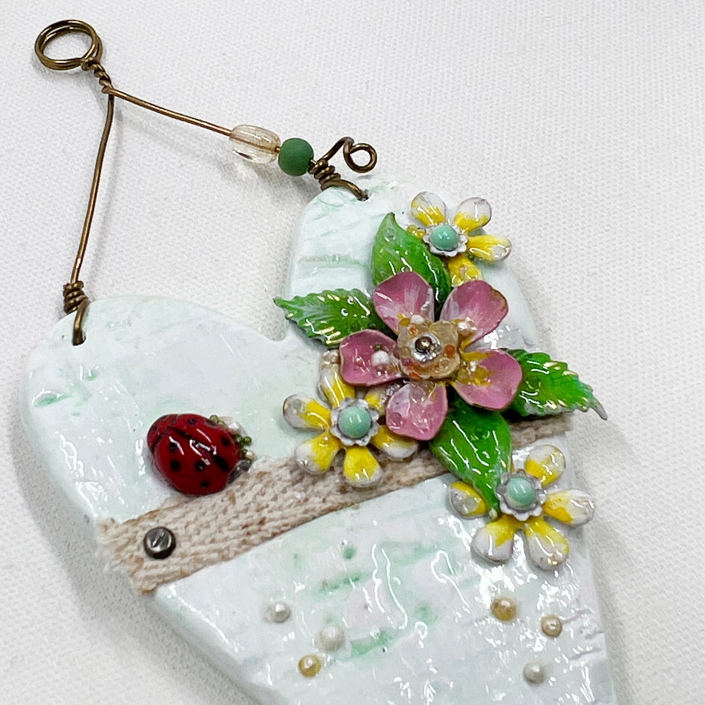 Handmade Heartfelt Ornament 11: hand sculpted heart with mixed media hand-painted enameled flowers by artist Tammy Tutterow