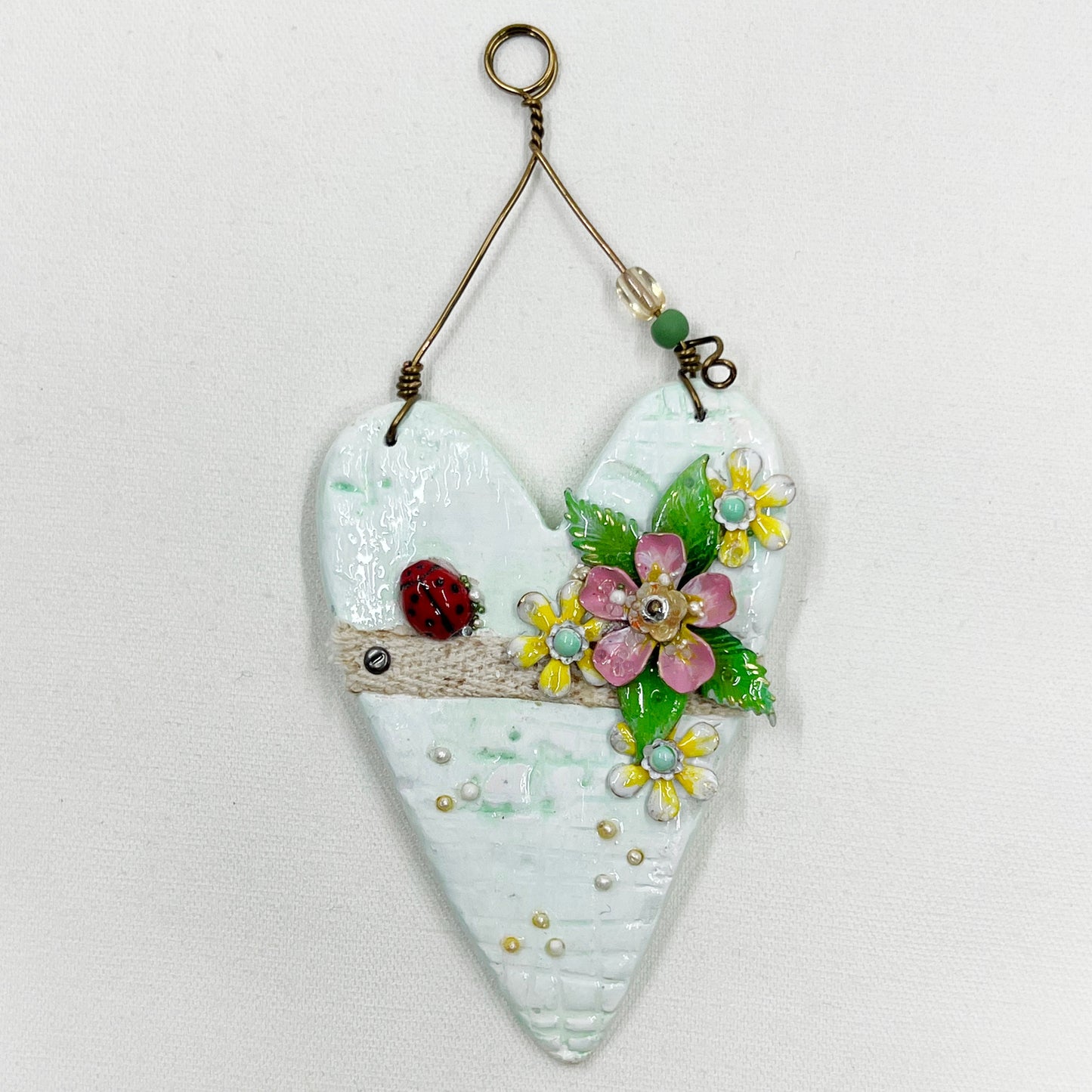 Handmade Heartfelt Ornament 11: hand sculpted heart with mixed media hand-painted enameled flowers by artist Tammy Tutterow